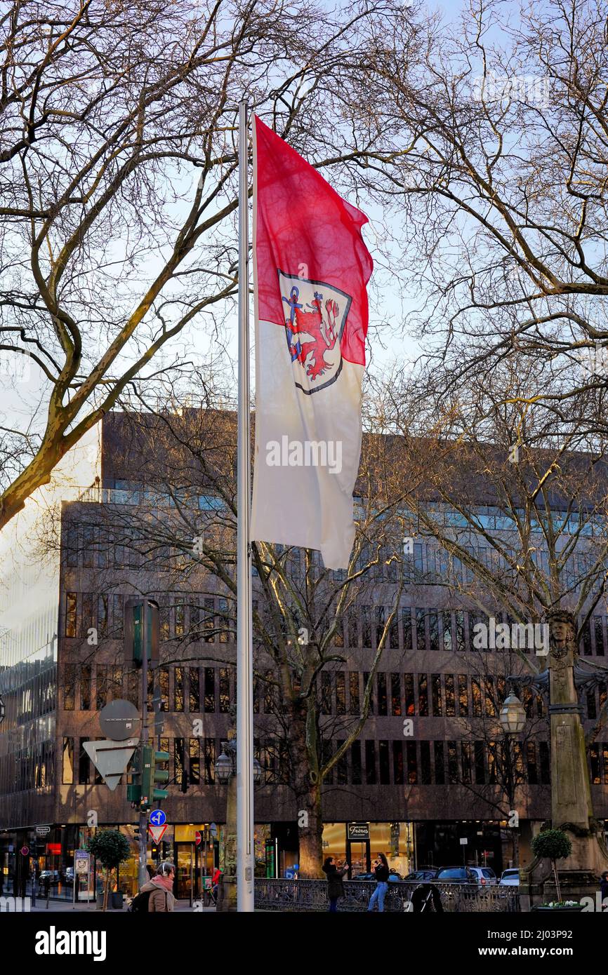 The flag of the city of Düsseldorf in Germany. The coat of arms shows the Bergischer Löwe (lion) with an anchor, symbol of the location on the Rhine. Stock Photo