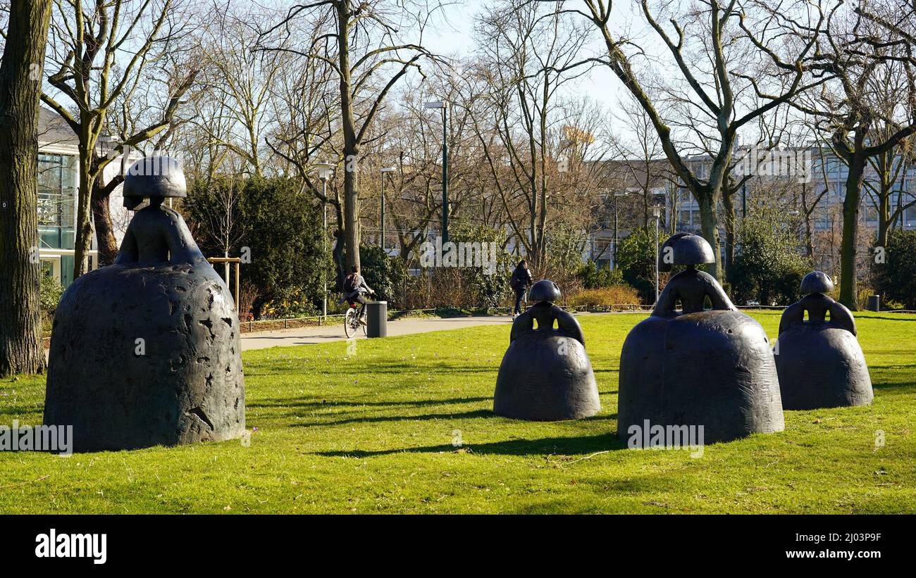 Düsseldorf's city park Hofgarten with 'Las Meninas' bronze sculptures by the artist Manolo Valdés. Stock Photo