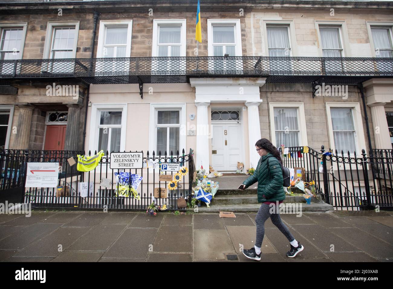 Edinburgh, UK. 16th Mar, 2022. People walk past messages of support left outside the Ukrainian Consulate in Edinburgh. Scotland. Pic Credit: Pako Mera/Alamy Live News Stock Photo