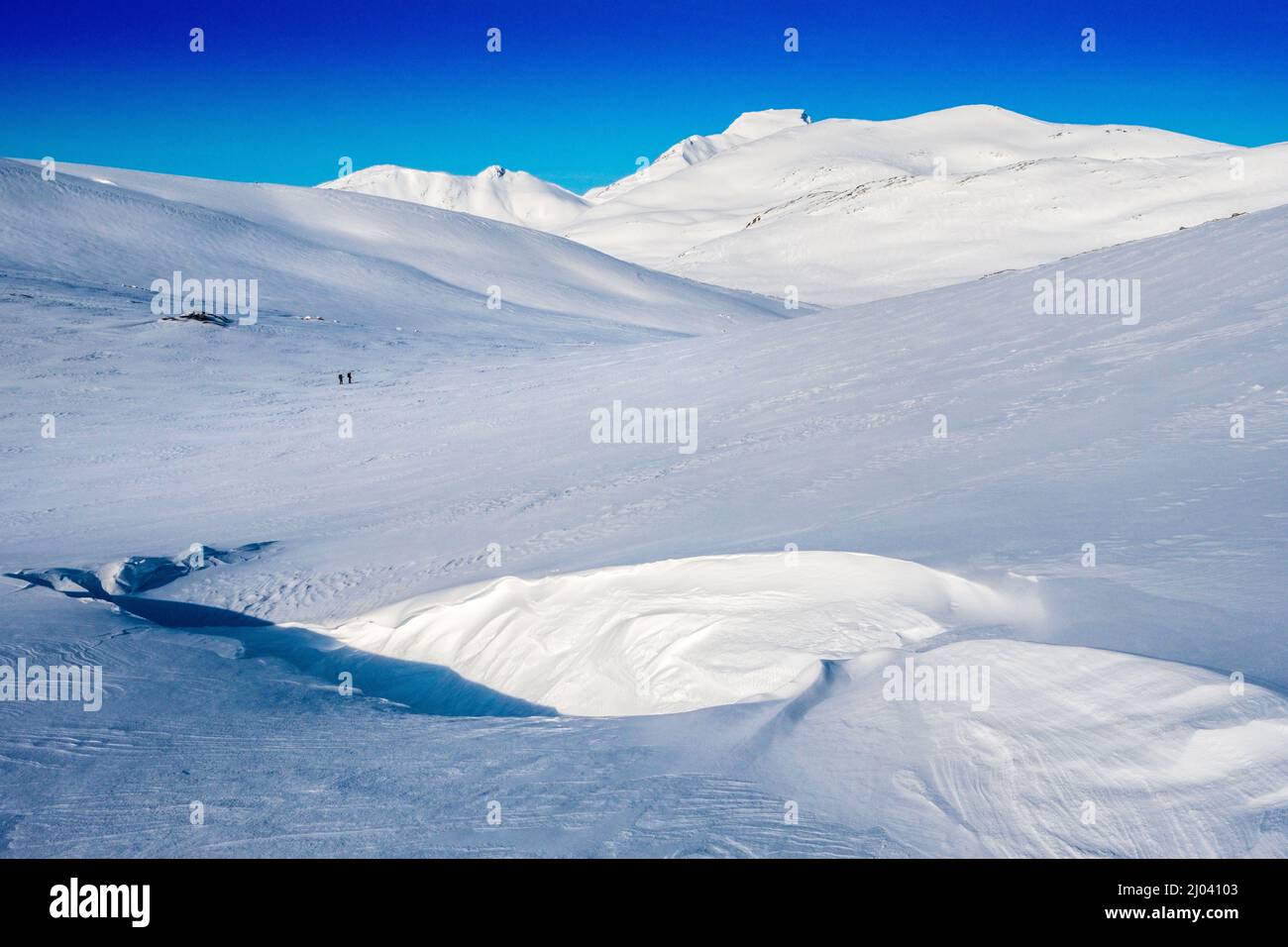 two skiers on a ski tour in theTrollheim region of Norway in winter Stock Photo