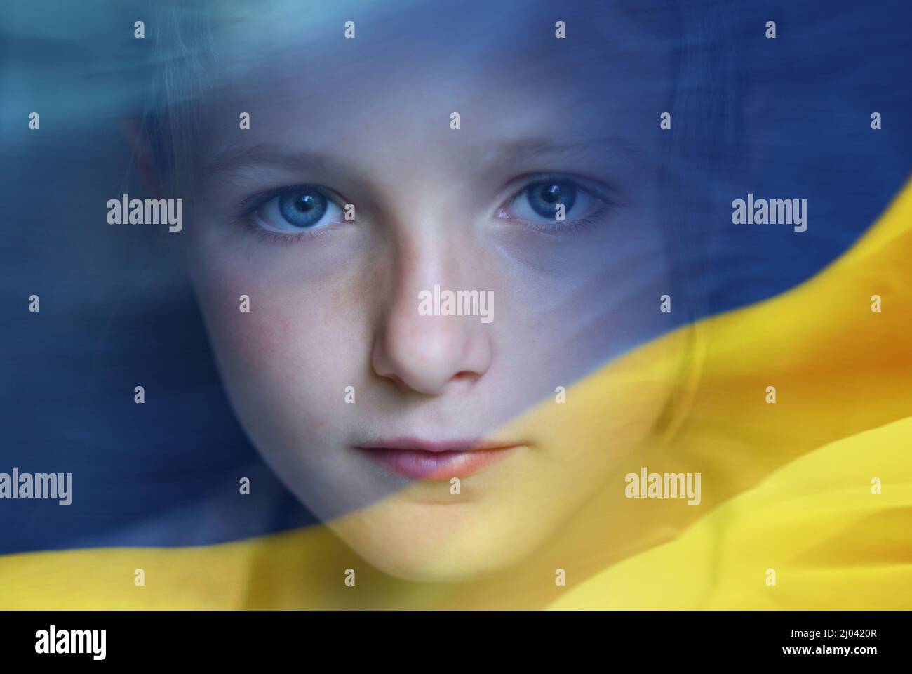 Double exposure of sad little child refugee and Ukrainian flag. Stock Photo