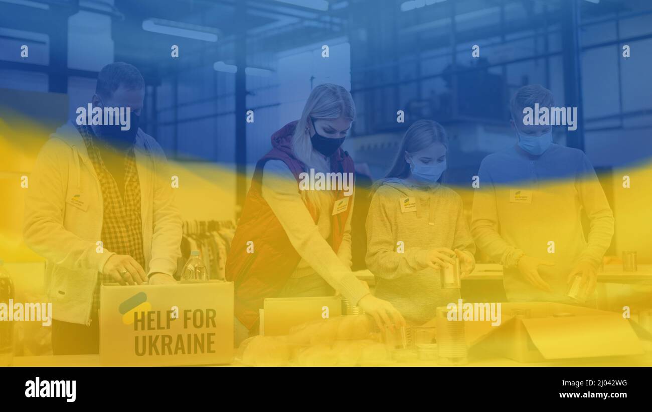 Volunteers sorting out donated food for the needs of Ukrainian migrants, humanitarian aid