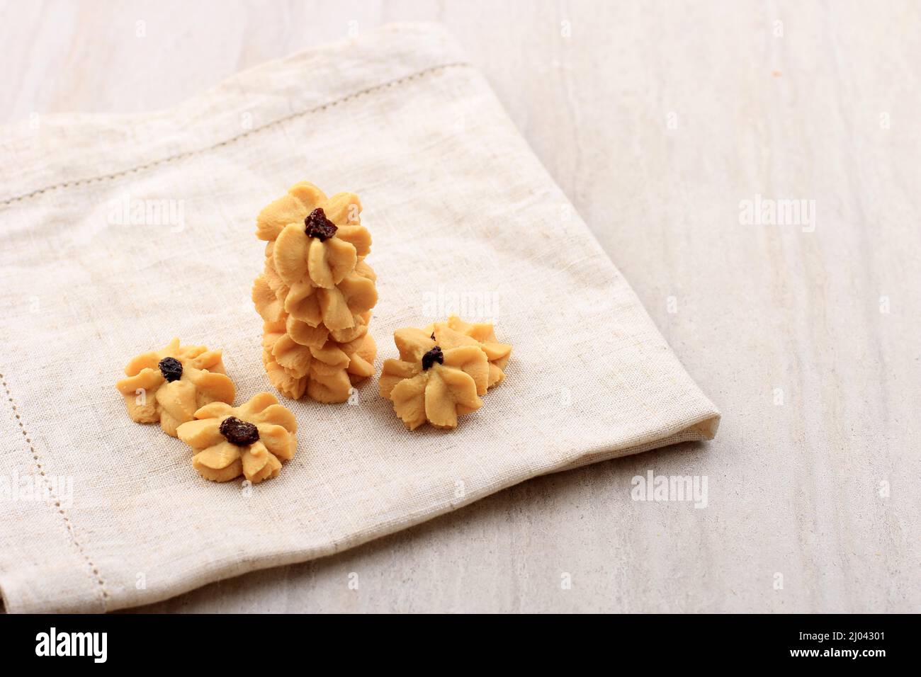 Kue Semprit, Indonesian Traditiona Cookies Served to Celebrate Lebaran  Idul Fitri Ied Mubarak. Made from Butter, Flour, Egg, with Flower Shape. Copy Stock Photo