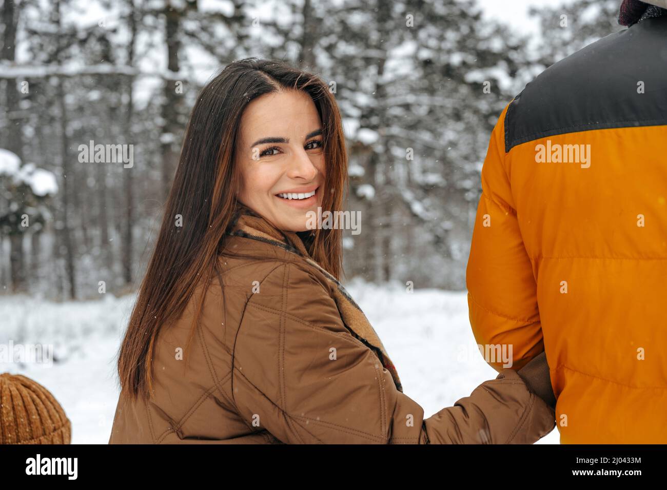 Happy family having a walk in winter outdoors in snow forest Stock ...