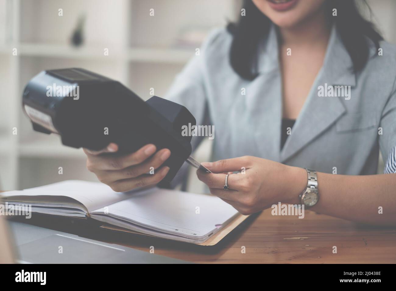 Hand of woman do Payment with credit card reader machine. Stock Photo