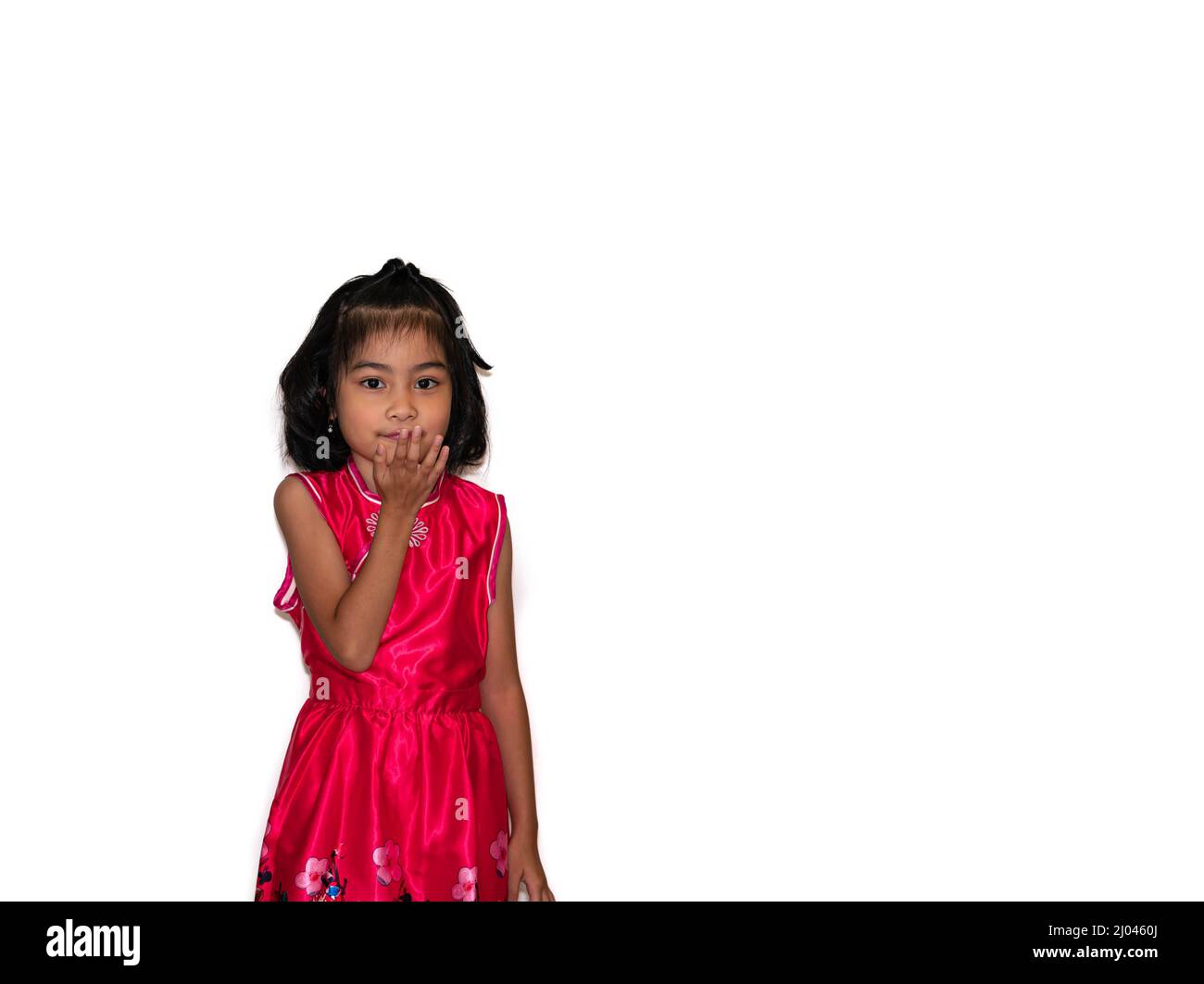 happy, smiling female asian kid playing and flying kiss Stock Photo
