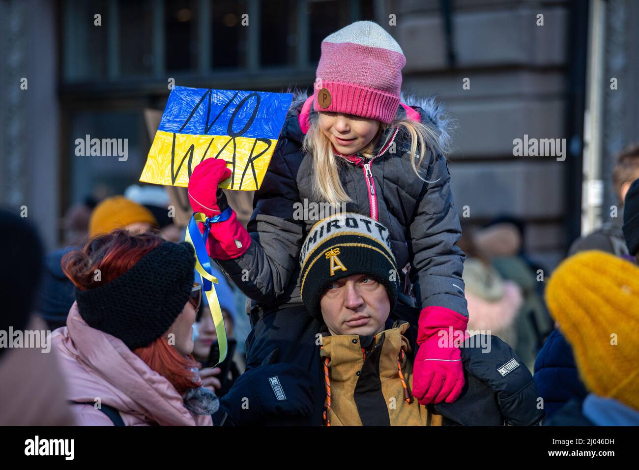 No war. Young girl holding a sign at protest against Ukraine war in Helsinki, Finland. Stock Photo