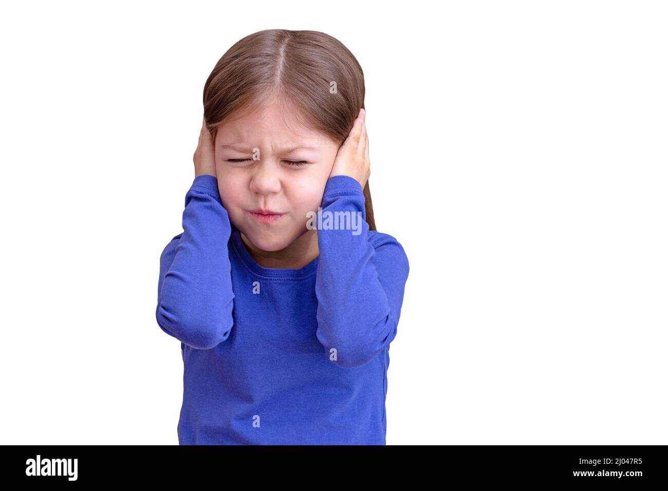 Child with closing ears by hands with closed eyes, isolated on white background waist up caucasian little girl of 5 years in blue Stock Photo