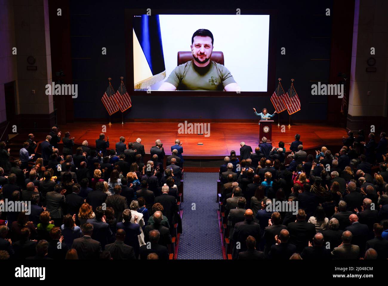 Speaker of the House Nancy Pelosi, D-Calif., introduces Ukrainian President Volodymyr Zelenskyy to speak to the U.S. Congress by video at the Capitol in Washington, Wednesday, March 16, 2022. Credit: J. Scott Applewhite / Pool via CNP Stock Photo