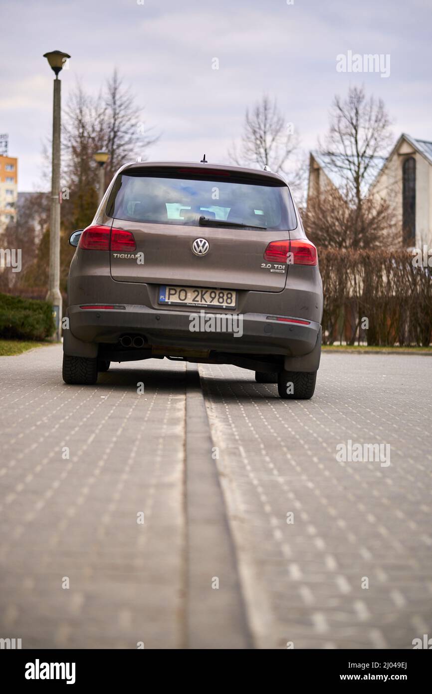 Parked Volkswagen Tiguan car by a sidewalk in the Stare Zegrze district Stock Photo