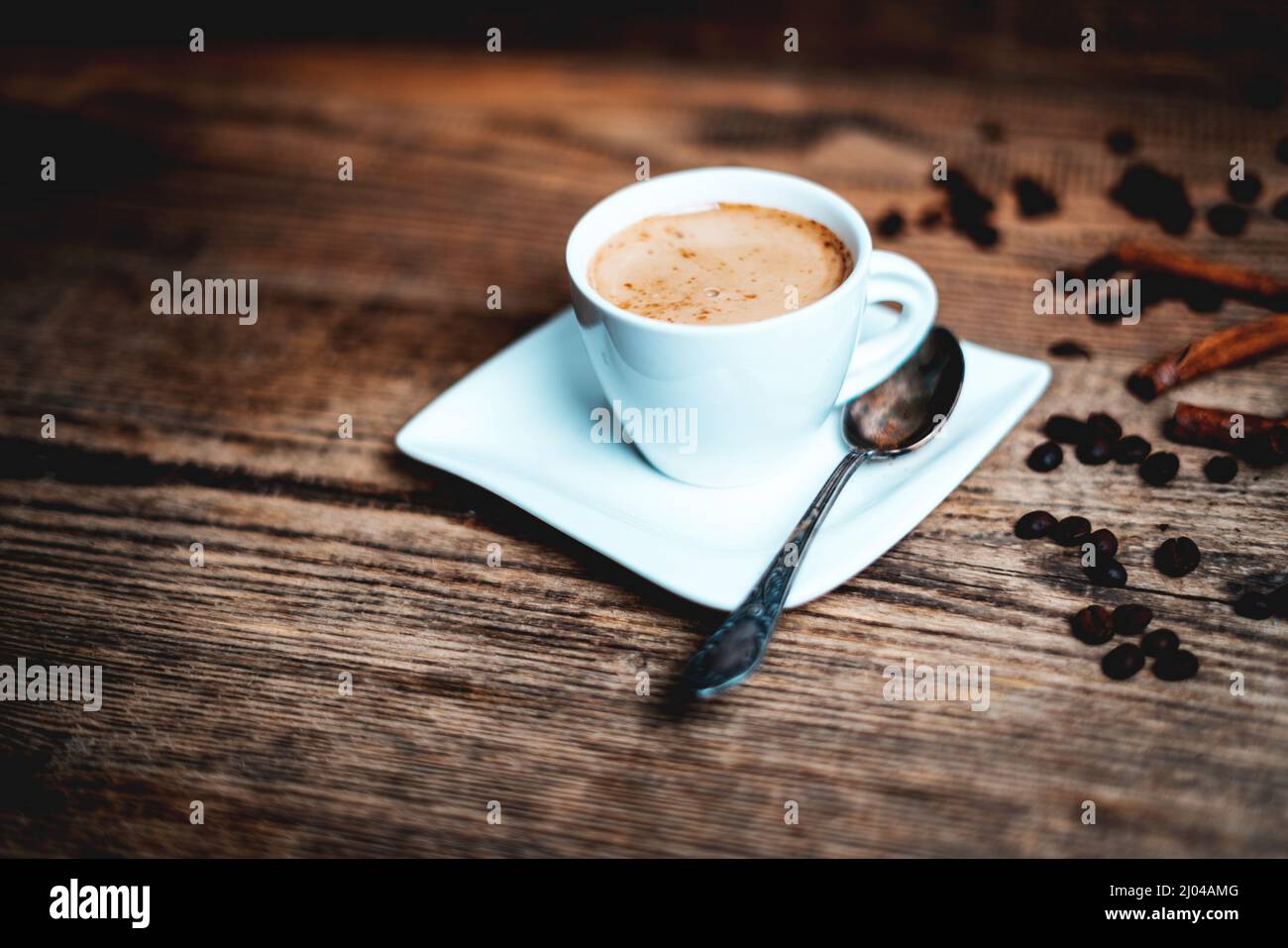 White porcelain cup of coffee  on wooden background Stock Photo