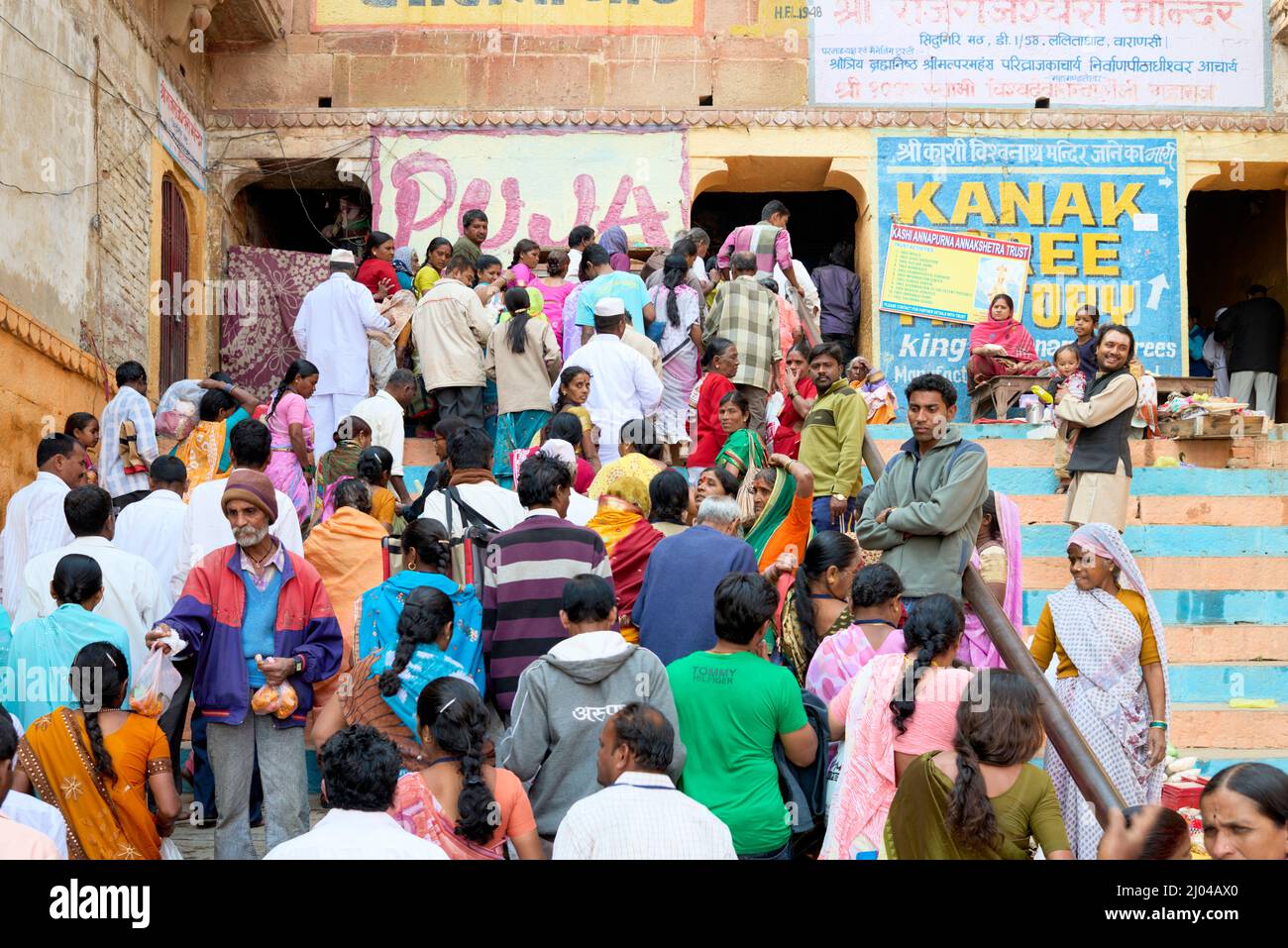 India. Varanasi Benares Uttar Pradesh. Pilgrims going to pray to an hindu temple Stock Photo