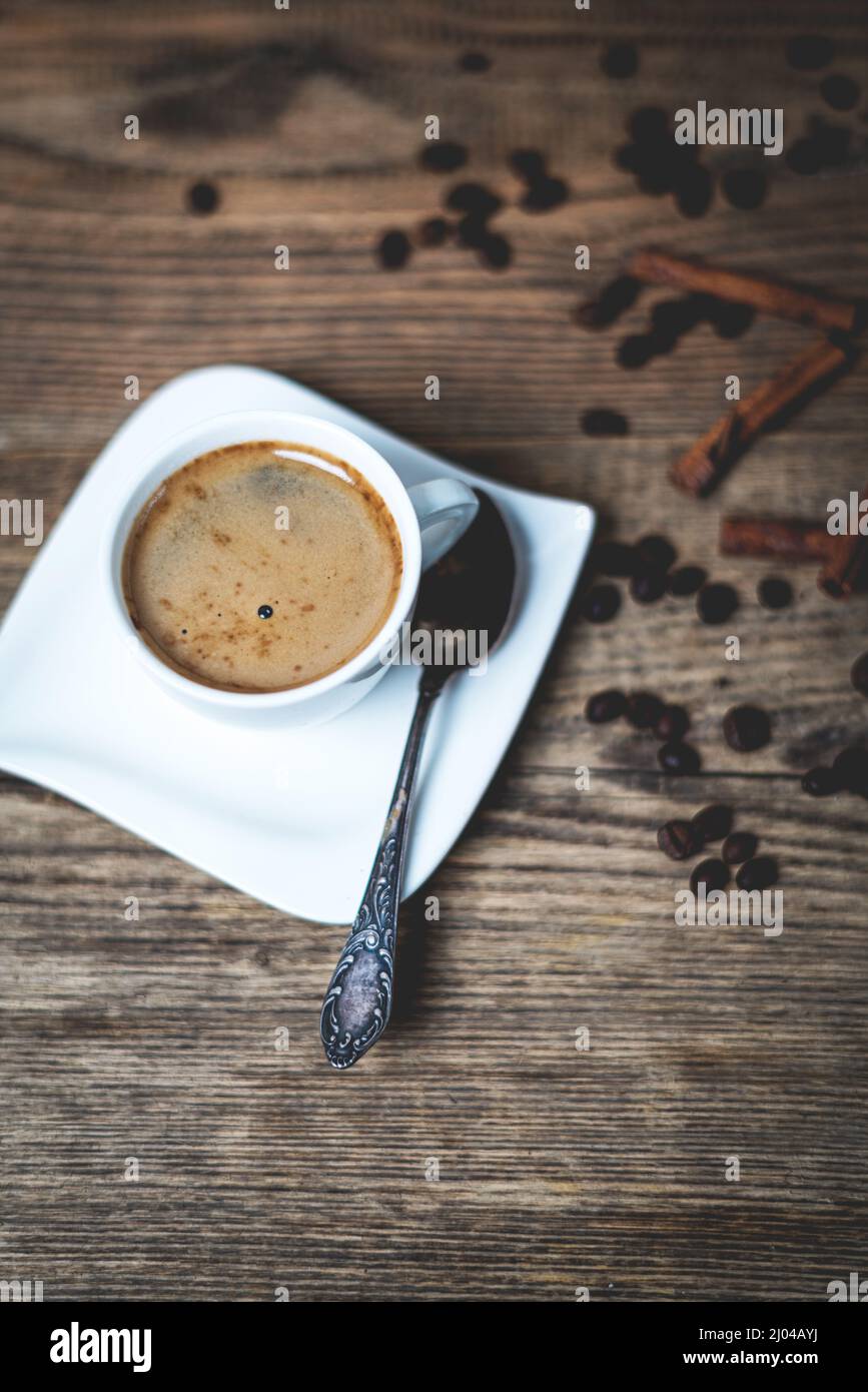White porcelain cup of coffee  on wooden background Stock Photo