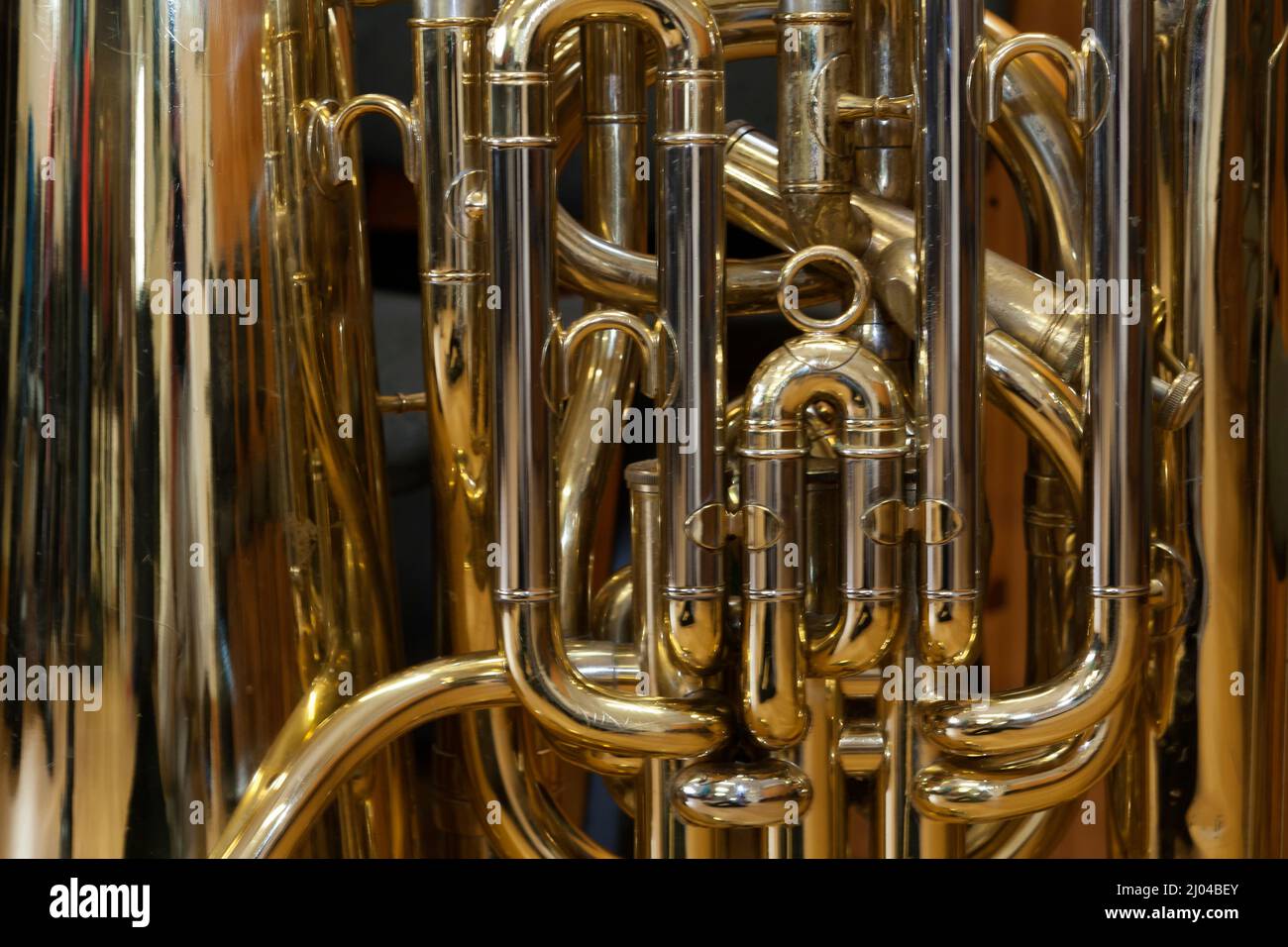 Abstract close-up of the complex tubing of a brass instrument: a tuba Stock Photo