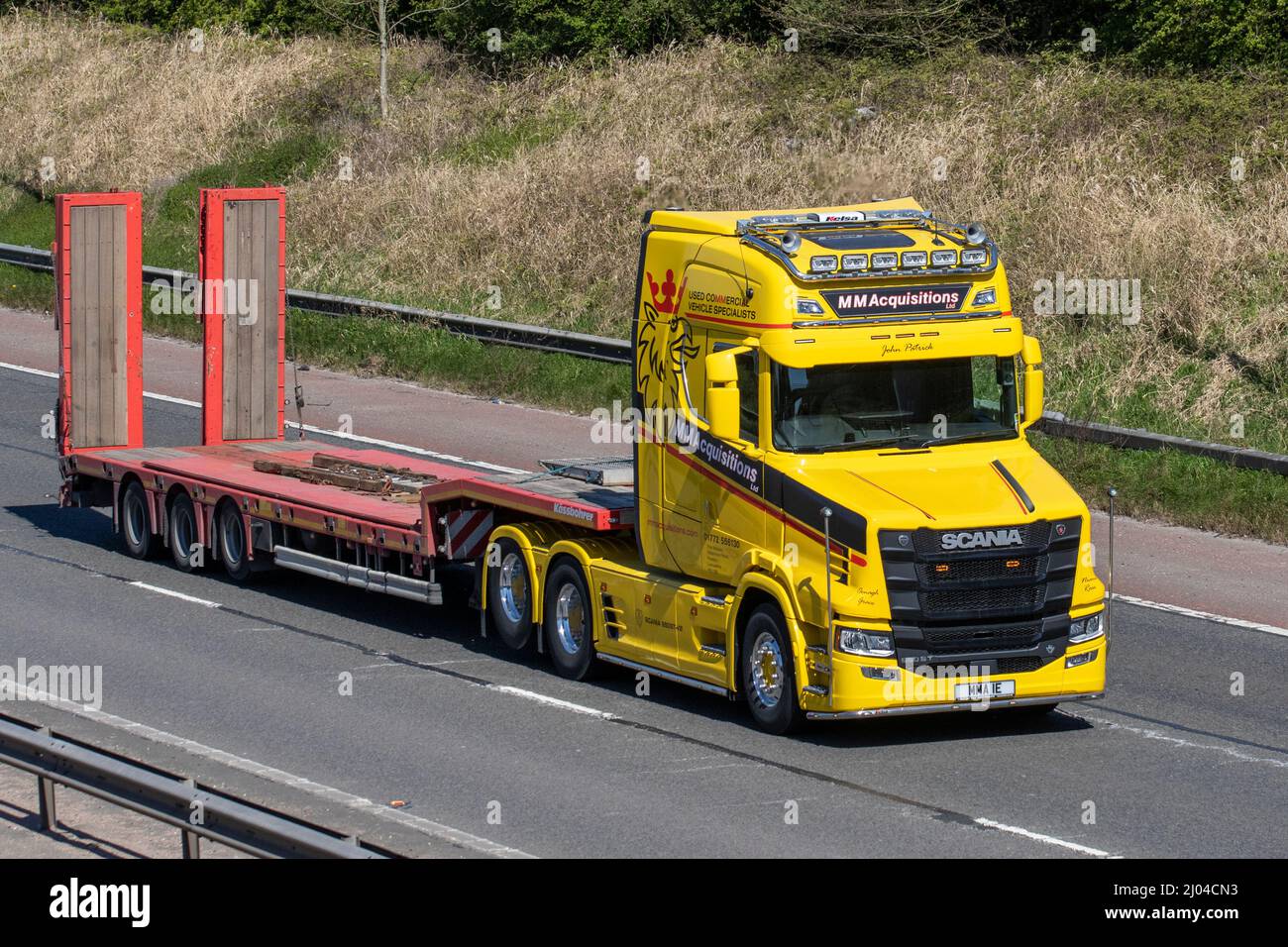 John Patrick M M Acquisitions used commercial Vehicle specialists 2020 SCANIA 650 ST-V8 yellow scania HGV truck transporter; livery lorry, heavy-duty vehicles, transportation, truck driving on the M61 Manchester, UK Stock Photo