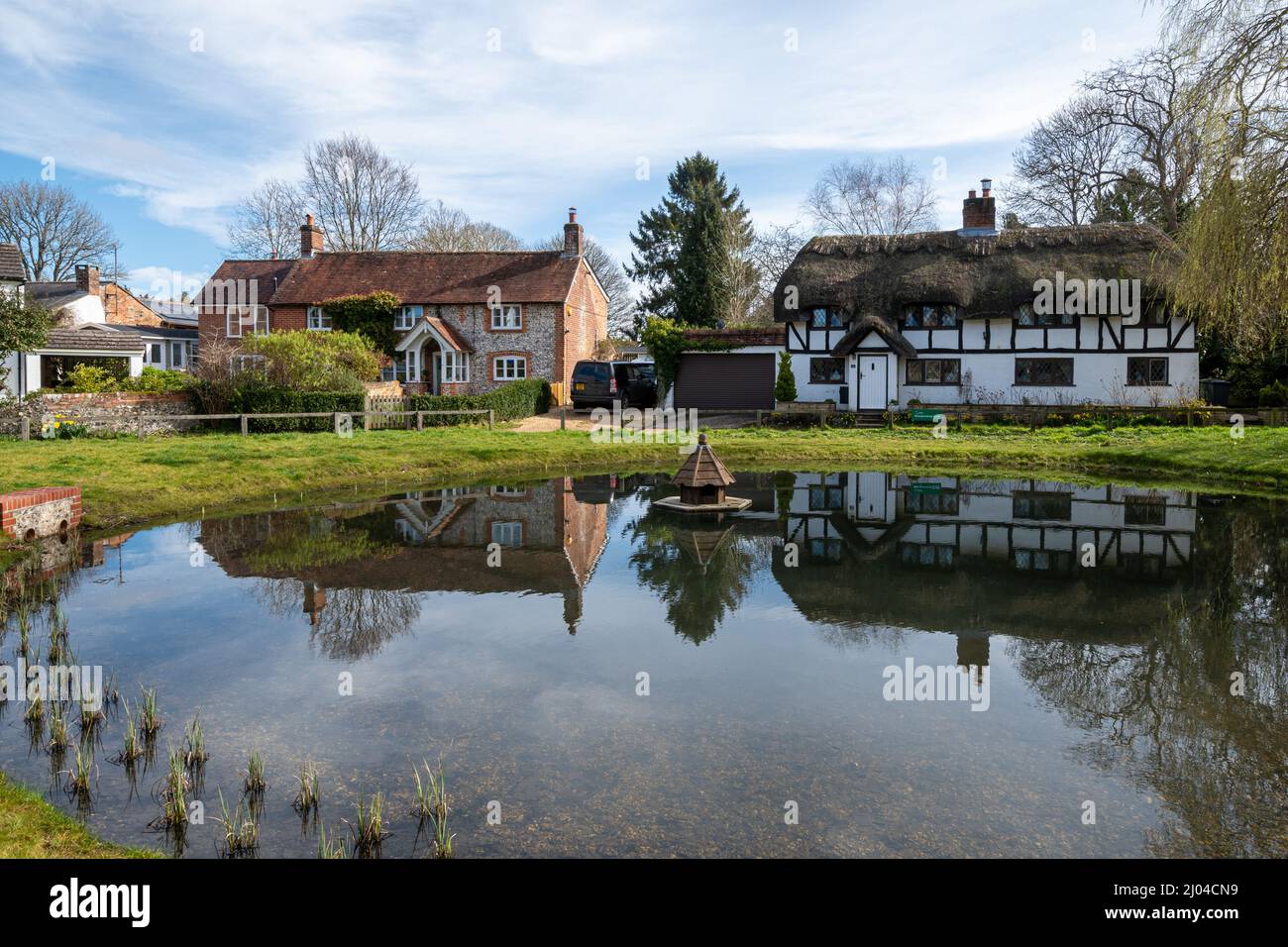 Oakley village with duck pond and cottages in Hampshire, England, UK