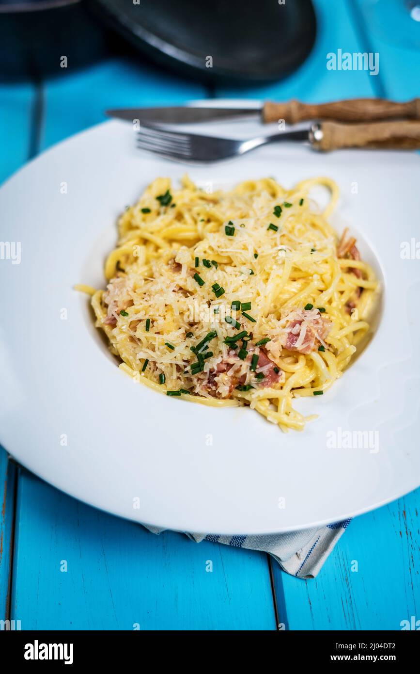 Italian cuisine pasta spaghetti ala carbora with egg, cheese parmasan and bacon Stock Photo