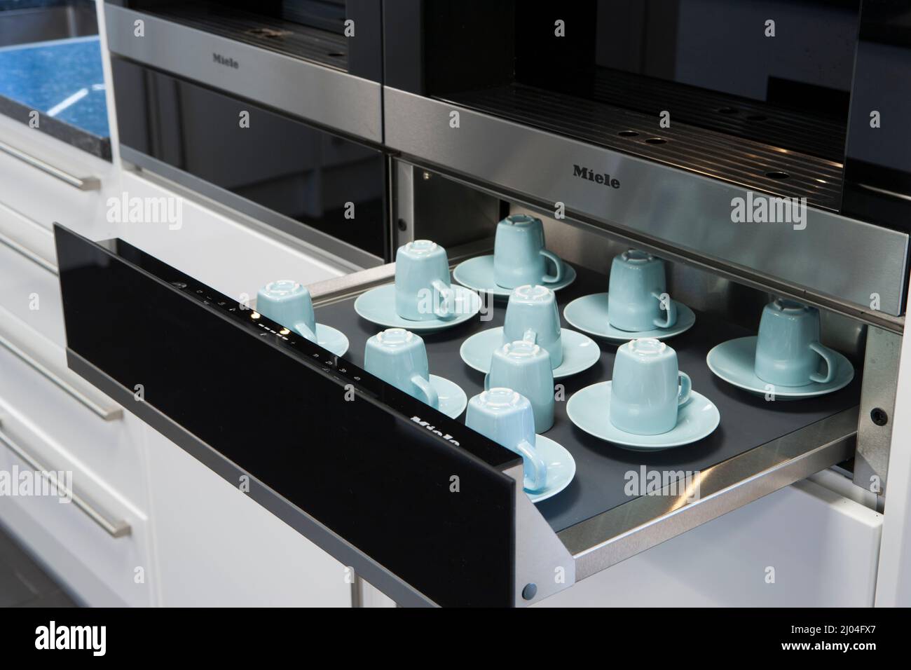 Office Interior. Dishwasher and cups Stock Photo