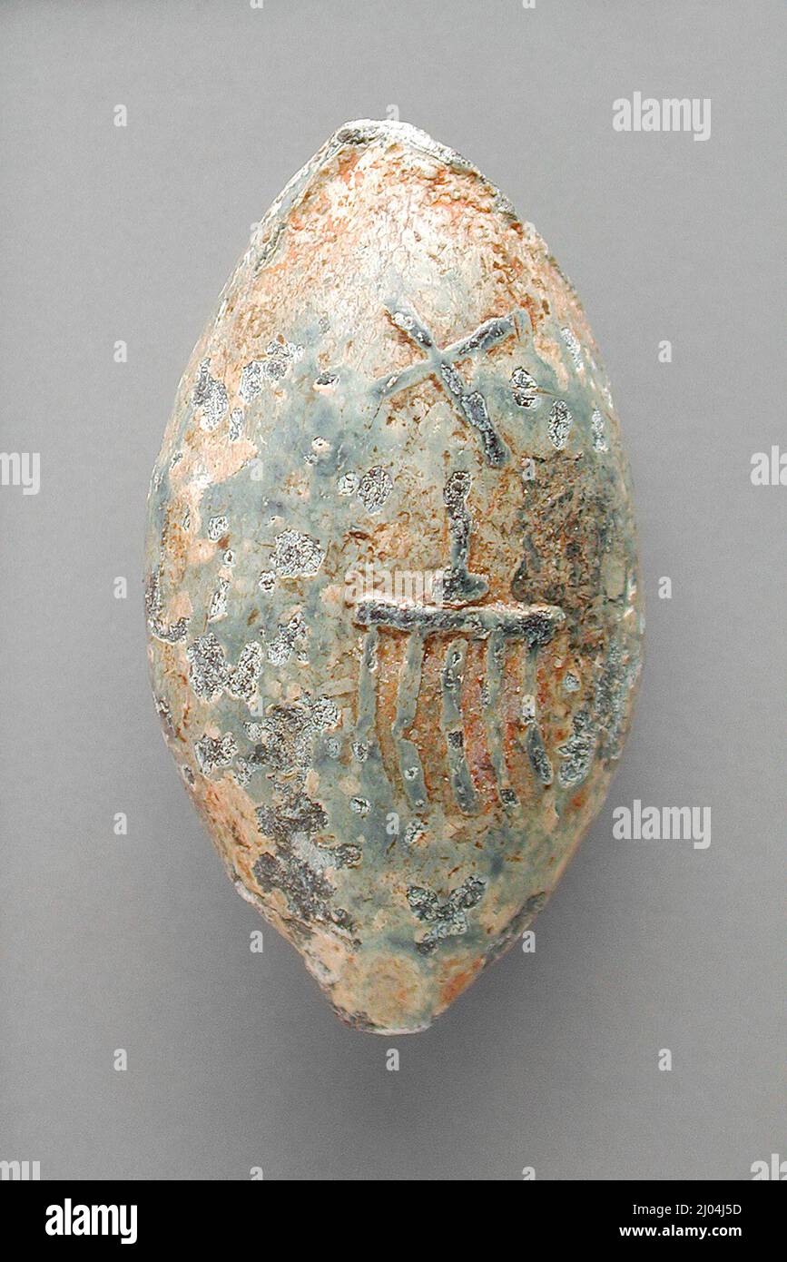 Sling Bullet with Greek Inscription (?). Egypt, Late Period Greco