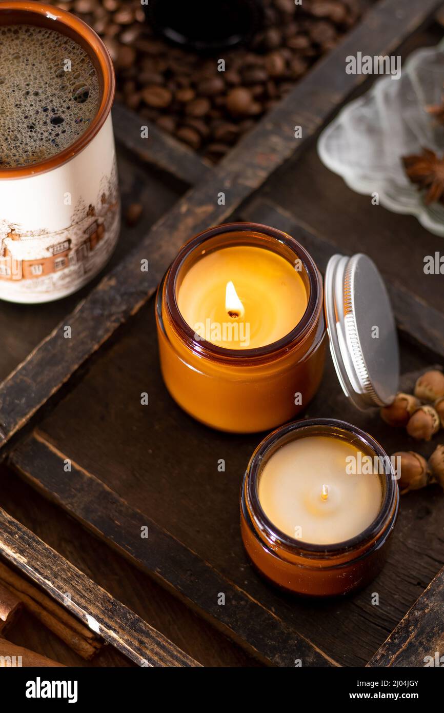 A set of different aroma candles in brown glass jars. Scented handmade