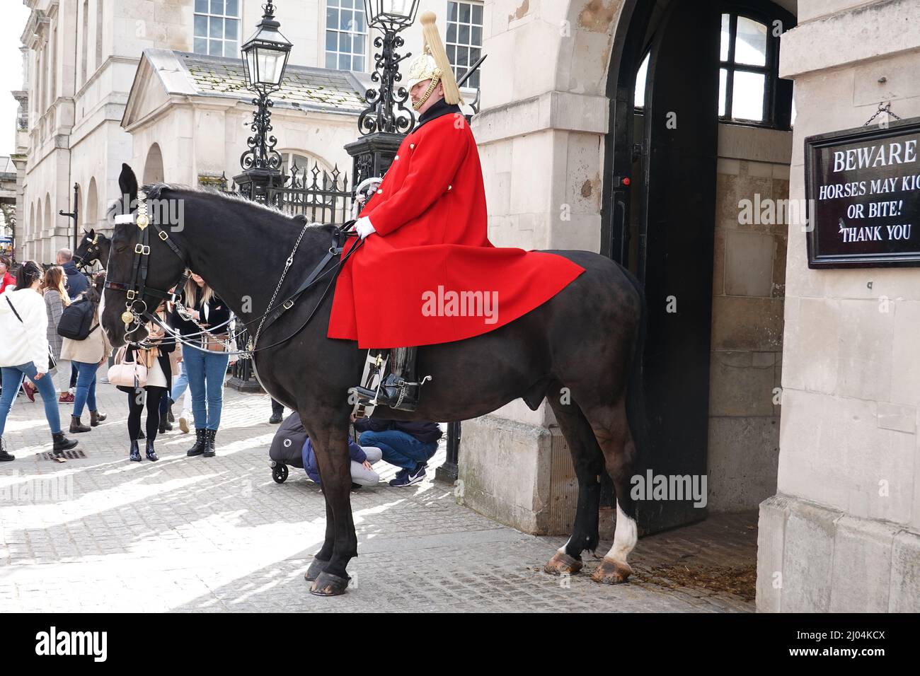 Whitehall, London 2022. Household Cavlary Guard in Red Uniform on horseback outside Horseguards parade. These soldiers protect the Queen. Stock Photo