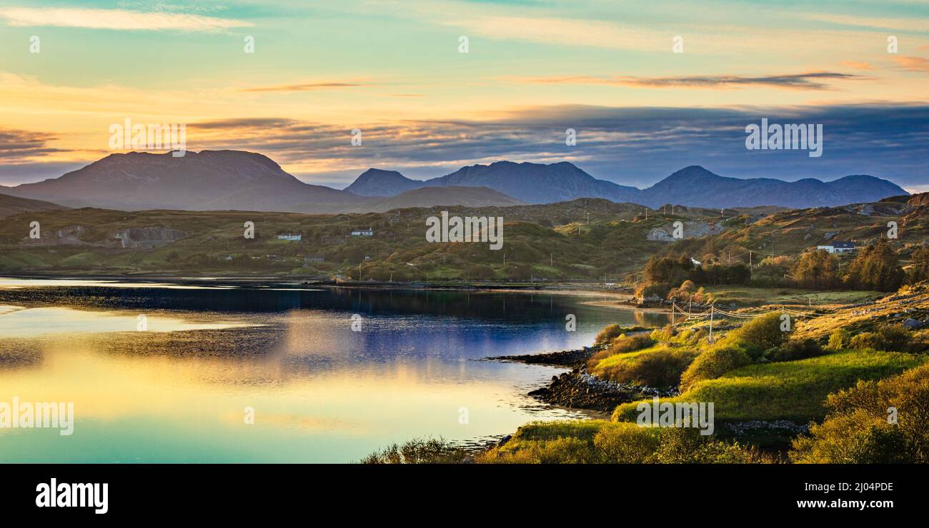 View along the south shore of Streamstown Bay to The Twelve Bens, Connemara, County Galway, Ireland. Stock Photo