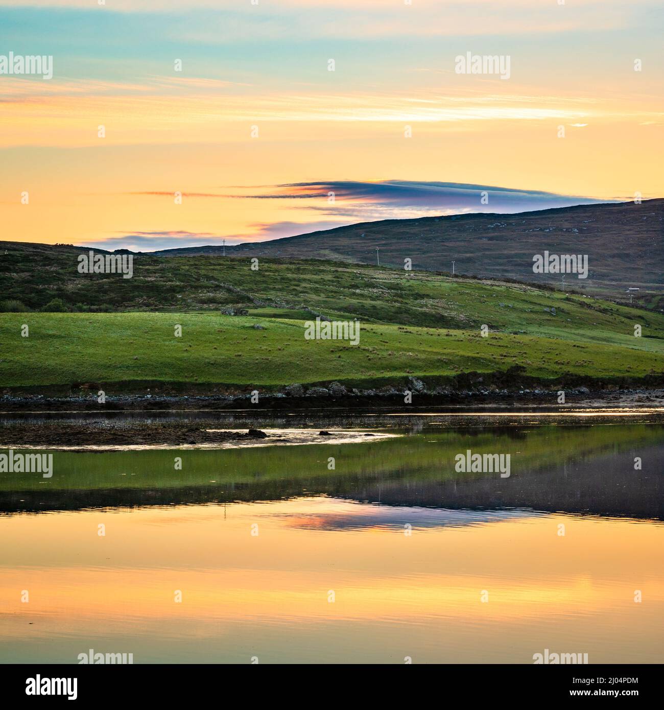 Sunrise across Streamstown Bay, Connemara, County Galway, Ireland Stock