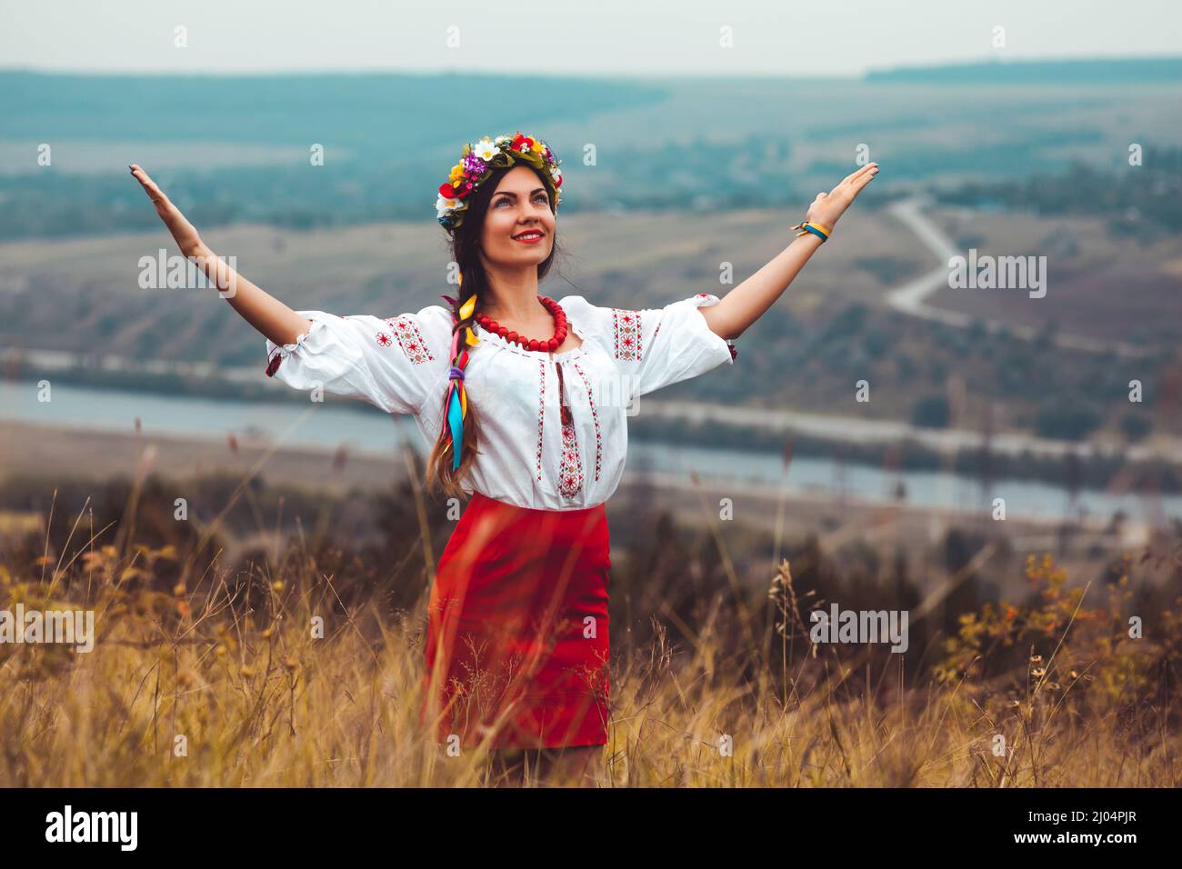 Portrait of woman in traditional ukrainian embroidery. Stock Photo