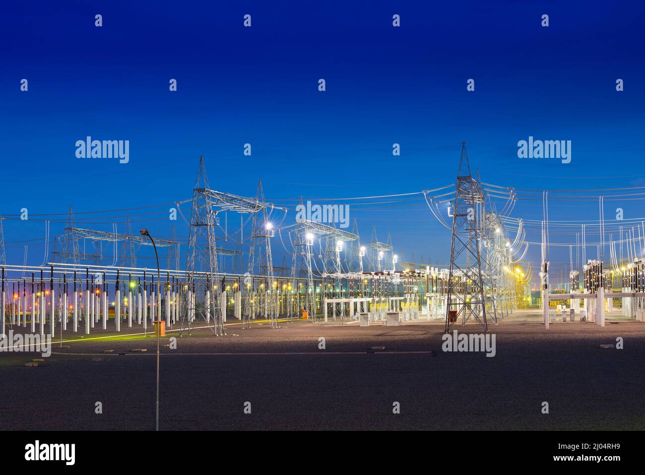 View of an electric substation at night Stock Photo