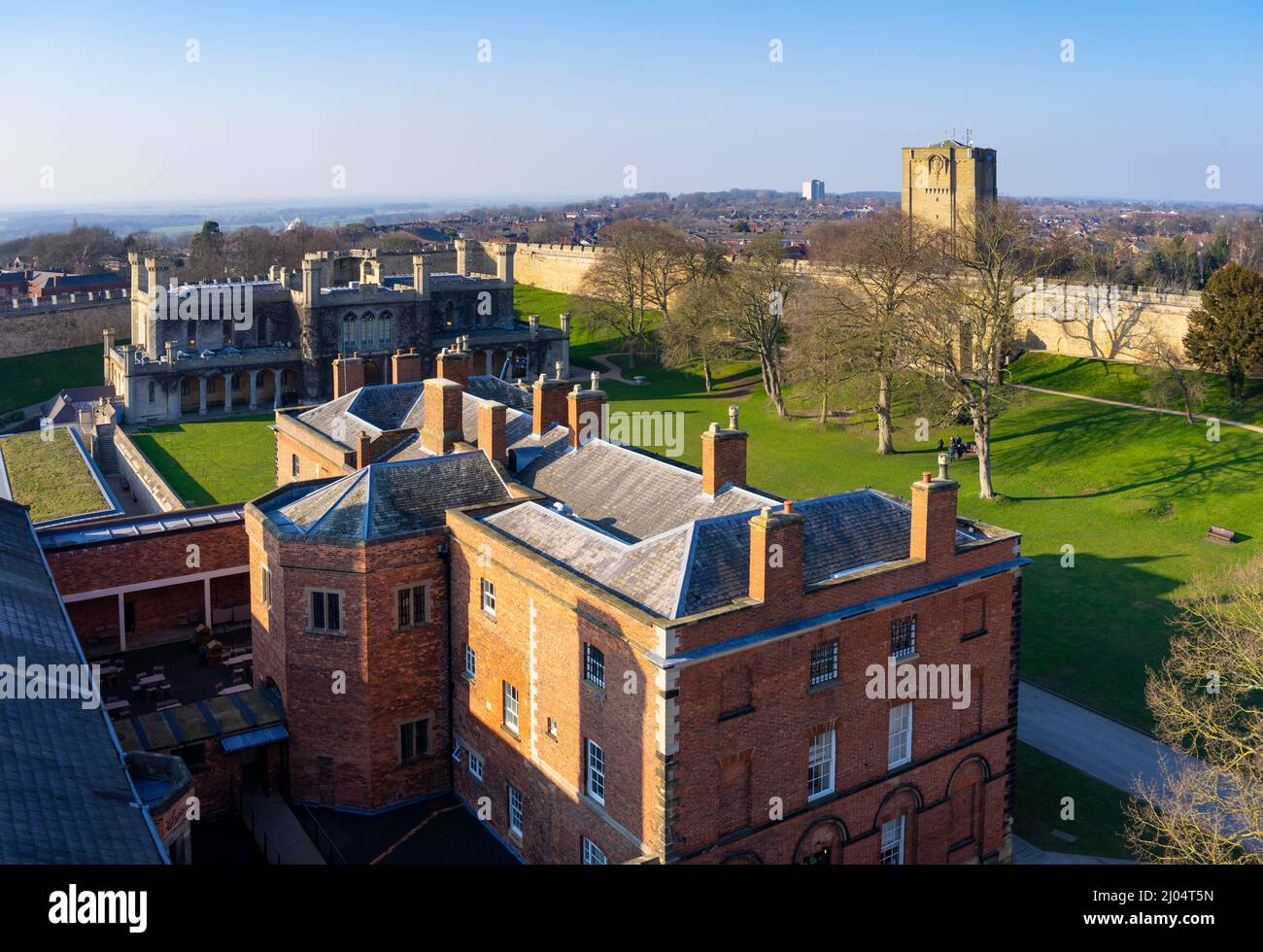 Aerial view of Lincoln Castle behind the Castle East gate of the Victorian Prison and Court House Lincoln Lincolnshire England UK GB Europe Stock Photo