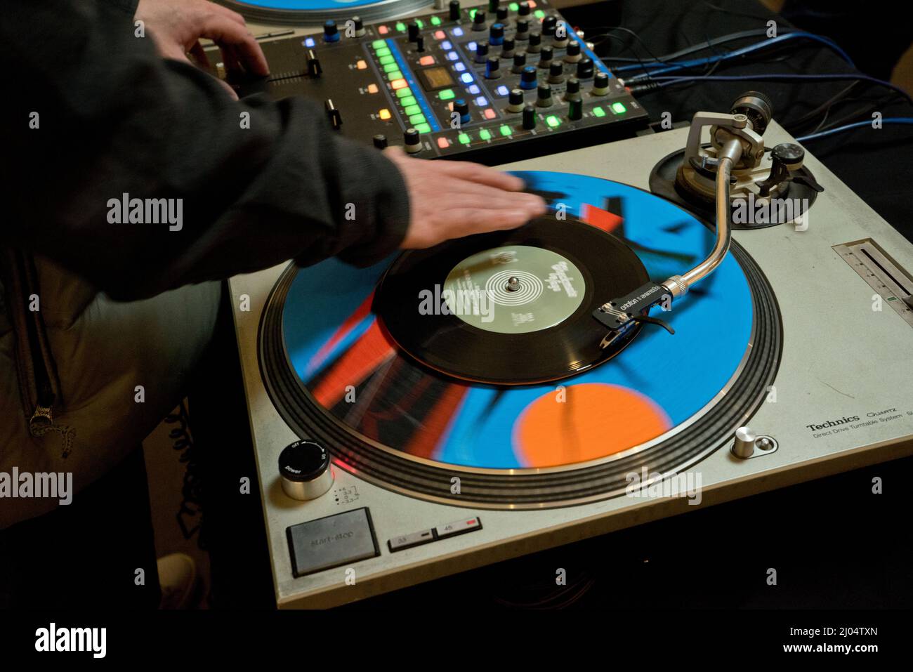 DJ playing vynil records at a party in Manchester,England,UK Stock