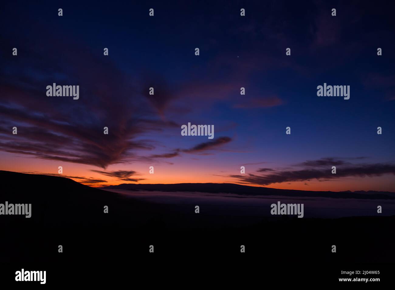 Photo of sunset behind of mountains Stock Photo - Alamy