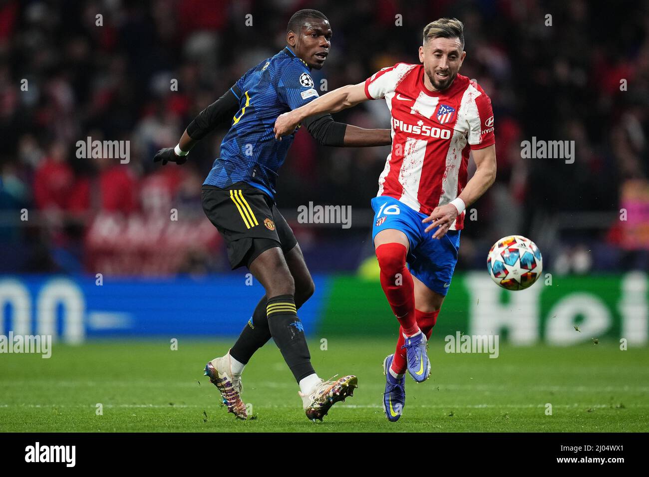 Paul Pogba of Manchester United and Hector Herrera of Atletico during the UEFA Champions League match, round of 16 between Atletico de Madrid and Manchester United played at Wanda Metropolitano Stadium on February 23, 2022 in Madrid, Spain.  (Colas Buera / Magma / Pressinphoto) Stock Photo