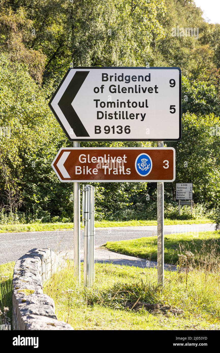 Sign for Glenlivet Bike Trails and Tomintoul Distillery at Bridge of Avon, near Tomintoul, Moray, Scotland UK. Stock Photo