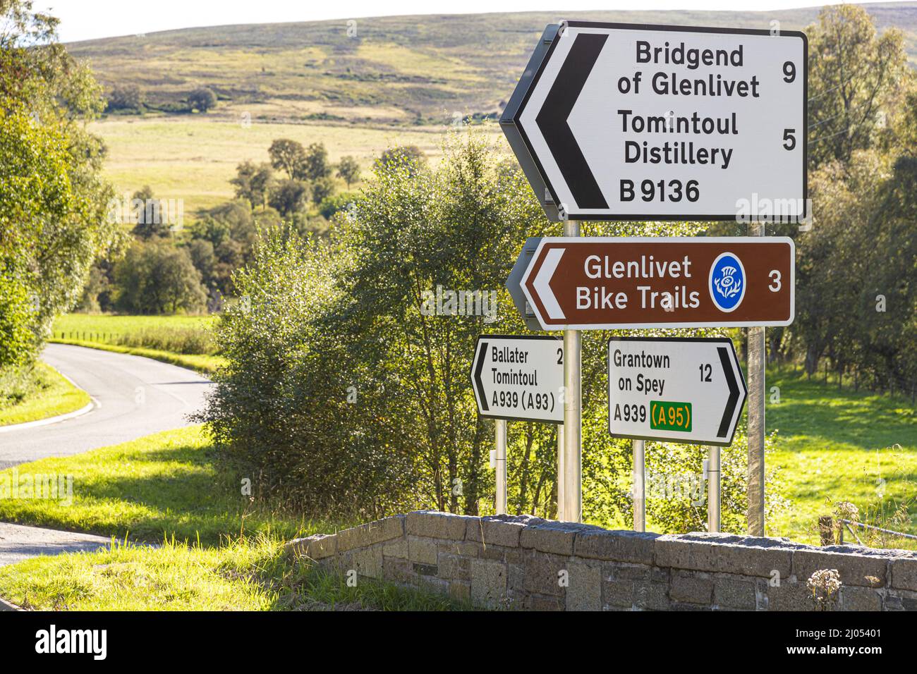 Sign for Glenlivet Bike Trails and Tomintoul Distillery at Bridge of Avon, near Tomintoul, Moray, Scotland UK. Stock Photo