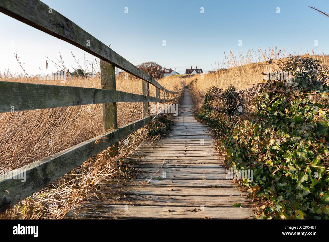 West Kirby, UK: Wooden footpath along coastal reserve, towards Red Rocks on the Wirral peninsula. Stock Photo