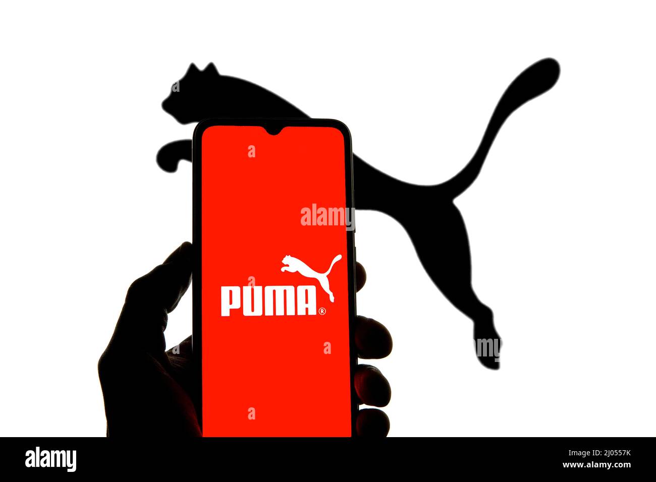 Spain. 11th Mar, 2022. In this photo illustration a Puma logo seen  displayed on a smartphone with a Puma logo in the background. (Credit  Image: © Thiago Prudencio/SOPA Images via ZUMA Press