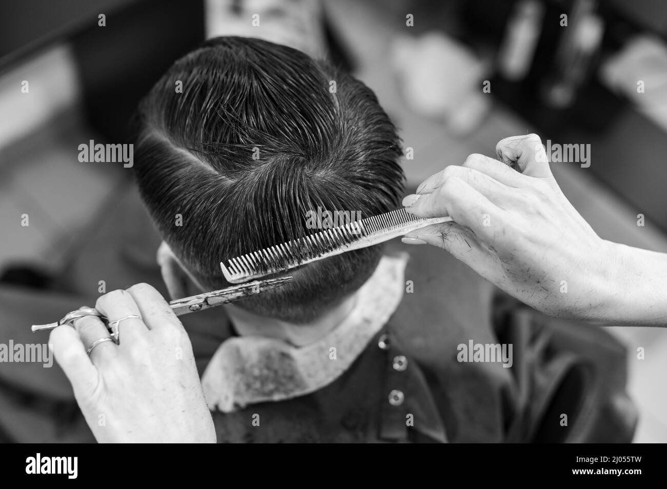 Teen guy gets a haircut during a pandemic in a haircut and