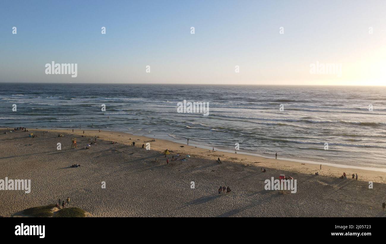 Beautiful beach with calm waves under a blue sky on a sunny day Stock ...