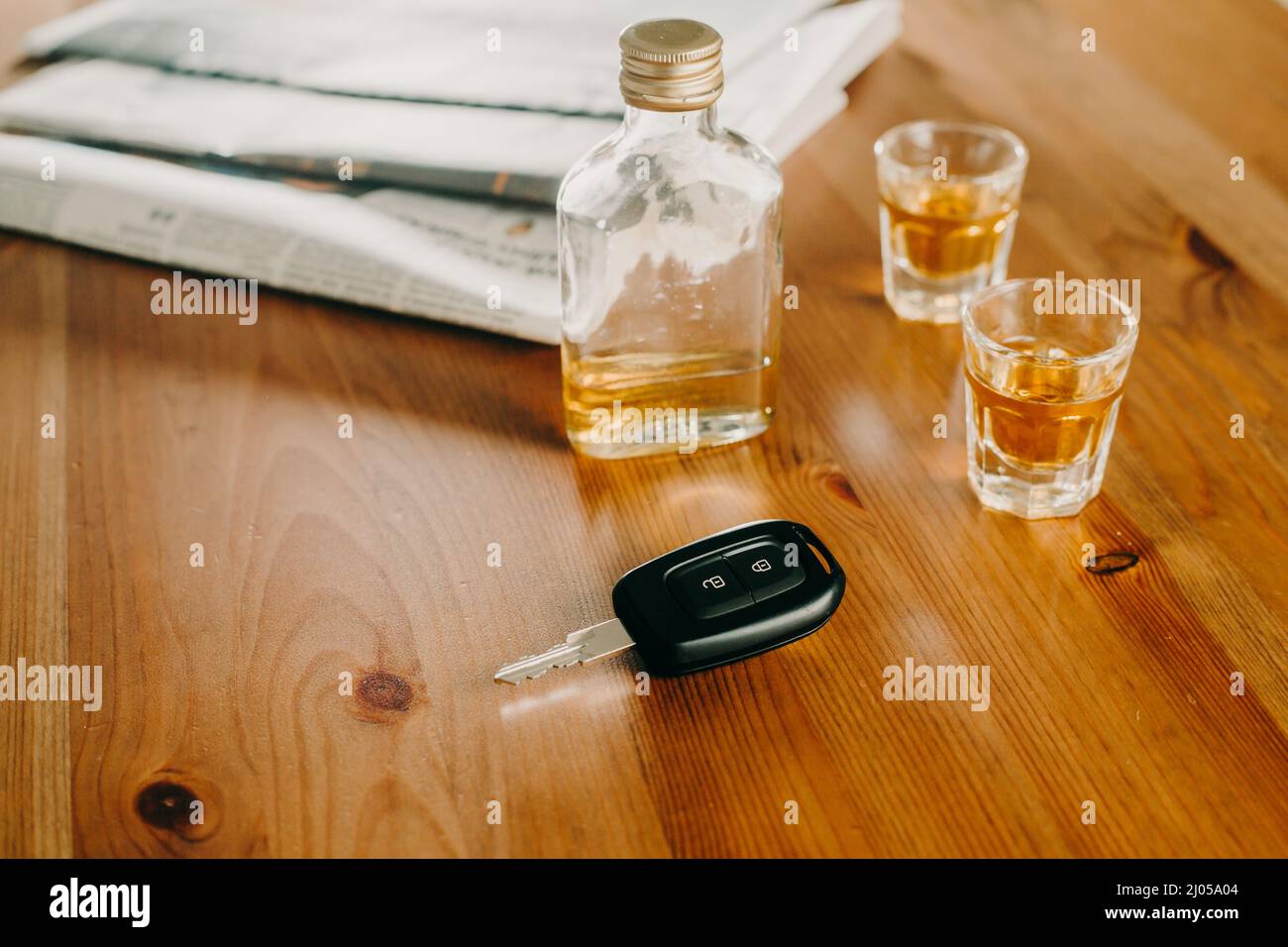 Do not drink and drive concept, Close up of car keys and glass of ...