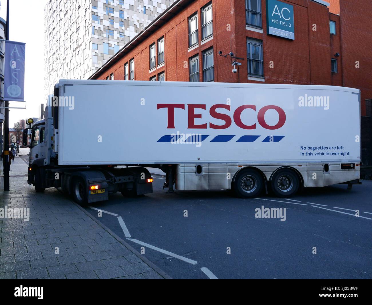 Tesco articulated lorry manoeuvering in city centre street Stock Photo