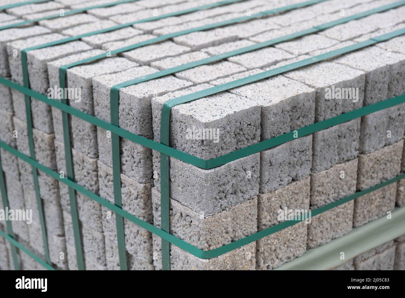 Paving stones on wooden pallet on the street sidewalk. Construction