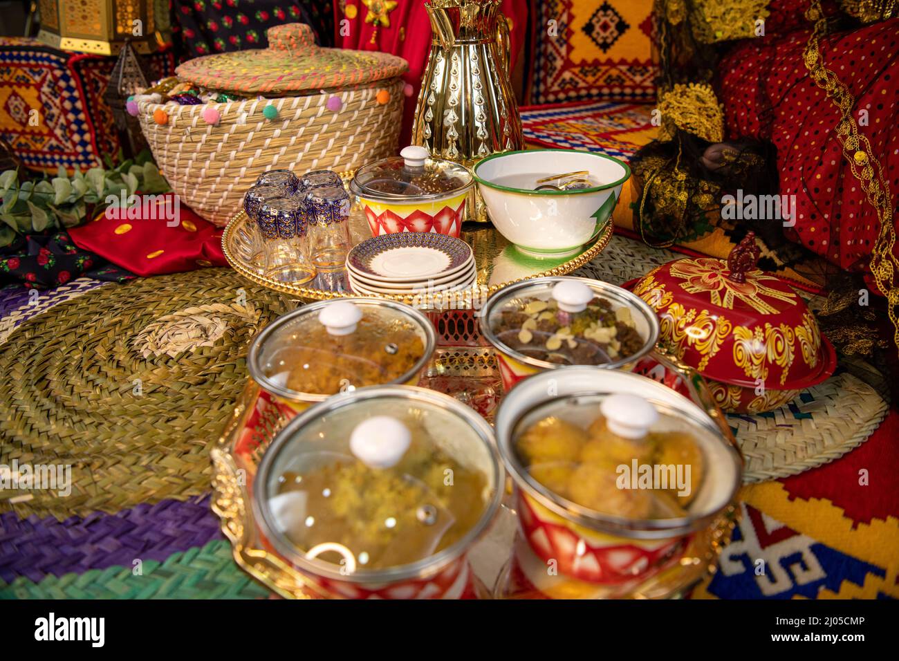 Islamic arts of blue Ramadan lantern as an Arabian Muslim celebration of Ramadan and garangao on oriental red carpet with Islamic geometry background Stock Photo