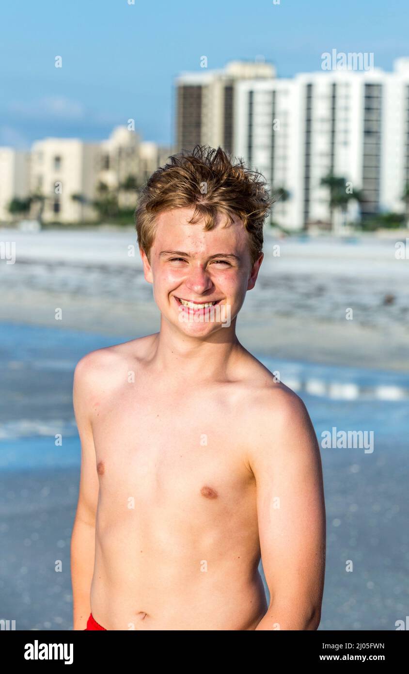 Teenage boy sitting beach looking hi-res stock photography and images -  Alamy