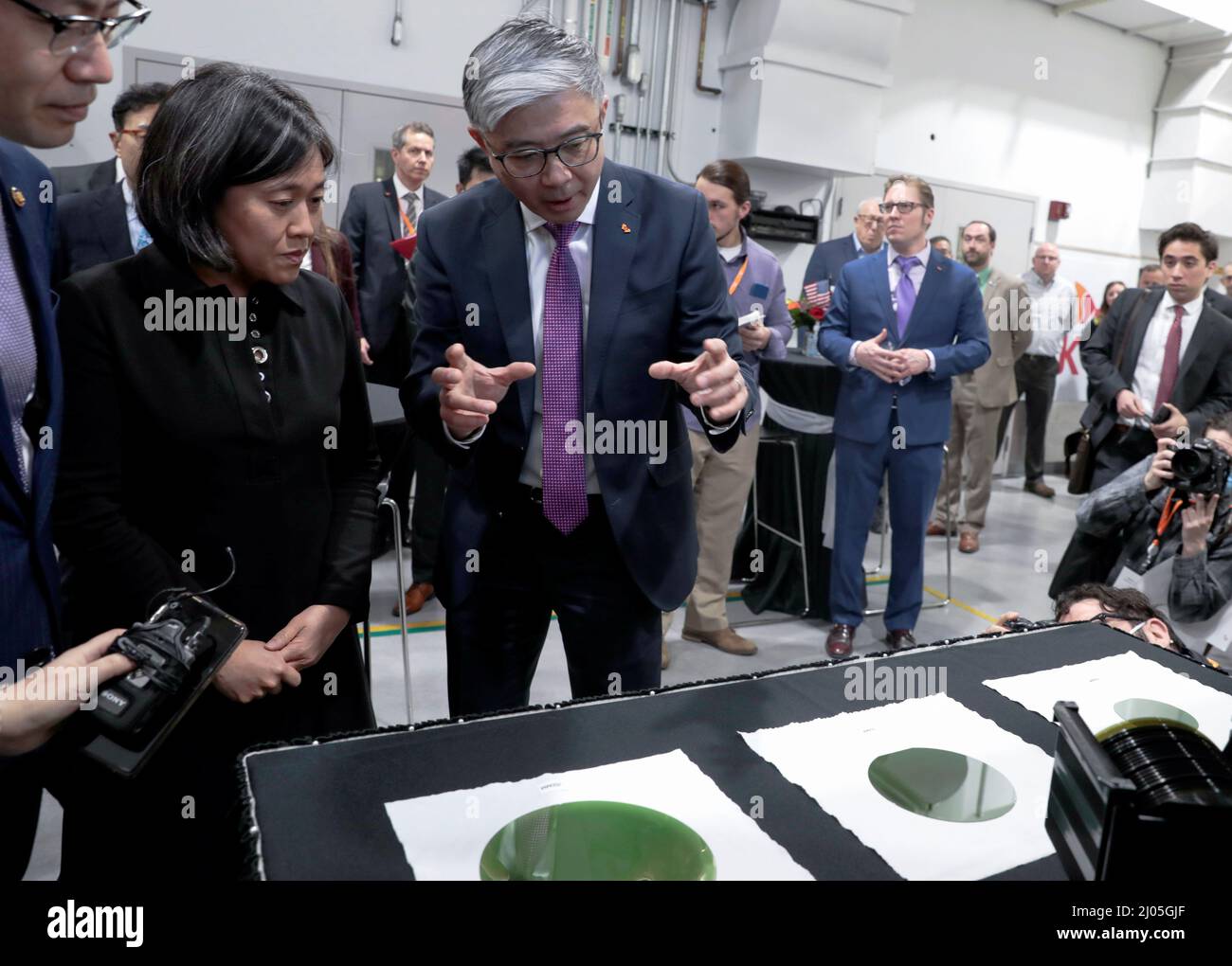 U.S. Trade Representative Ambassador Katherine Tai listens to Jianwei Dong, Chief Executive Officer (CEO) of South Korean semiconductor manufacturer SK Siltron CSS, during a tour of a silicon wafer plant being expanded by SK Siltron CSS in Auburn, Michigan, U.S., March 16, 2022.   REUTERS/Rebecca Cook Stock Photo