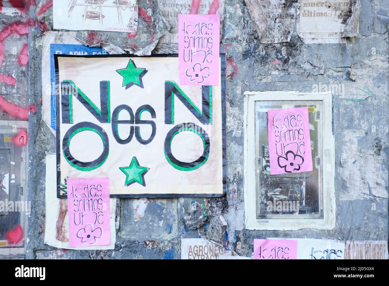 CABA, Buenos Aires, Argentina; March 8, 2022: international feminist strike. Wall full of posters and feminist messages, claiming the rights of women. Stock Photo
