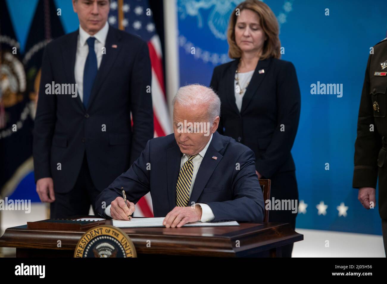 United States President Joe Biden signs a bill for the assistance the United States is providing to Ukraine in the South Court Auditorium of the Eisenhower Executive Office Building on the White House Campus in Washington, DC, Wednesday, March 16, 2022. Credit: Rod Lamkey/CNP /MediaPunch Stock Photo