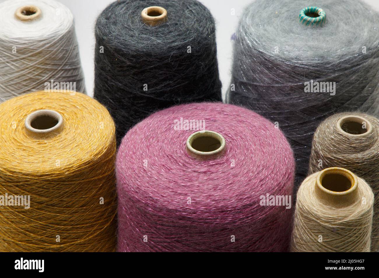 Colorful yarn on spool at the knitting factory. Yarn on tube, cotton