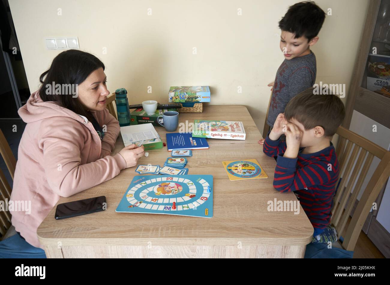 Woman sitting in a car and playing a Pokemon Go game Stock Photo - Alamy