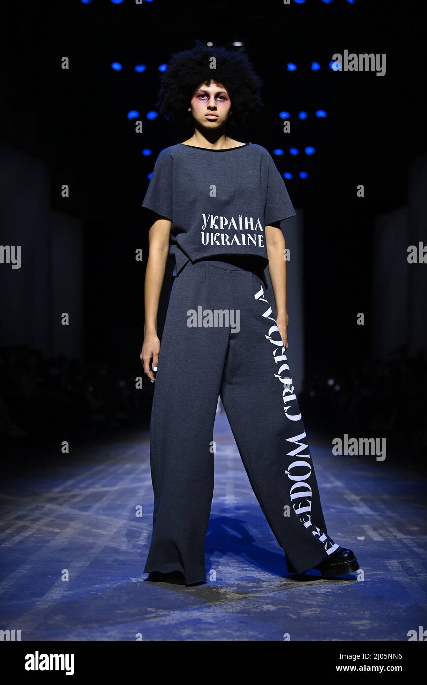 Berlin, Germany. 16th Mar, 2022. Berlin Fashion Week: At Kraftwerk Berlin,  a model presents a creation by Ukrainian designer Jean Gritsfeld